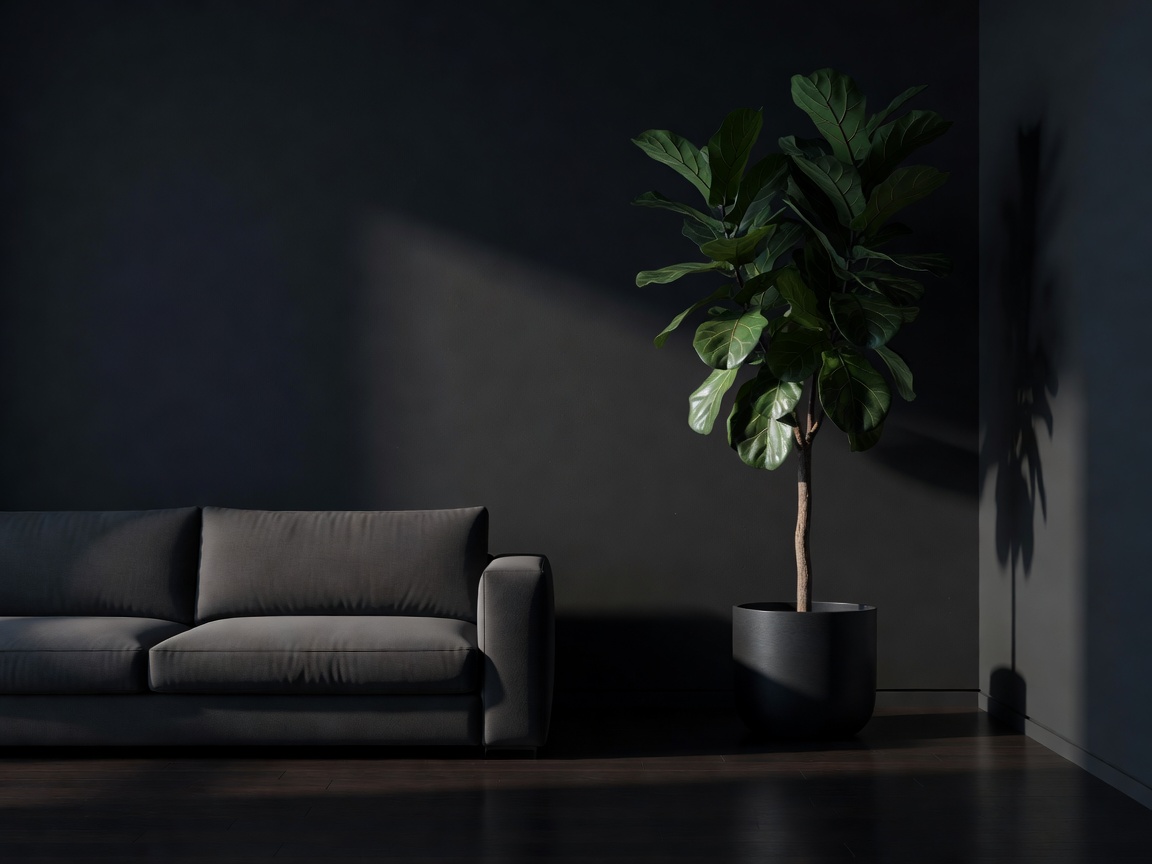 A dark living room with a low profile sofa offset by a tall architectural plant